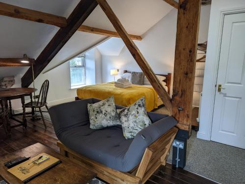 a living room with a couch and a bed at Lake View Country House in Grasmere