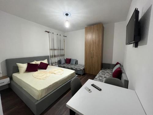 a small room with a bed and a couch at Victoria Houses, Vlore Albania in Vlorë