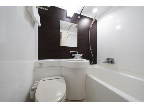 a bathroom with a toilet and a sink and a tub at Seto Park Hotel - Vacation STAY 83745v in Seto