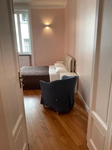 A bed or beds in a room at VIA DANTE APARTMENT