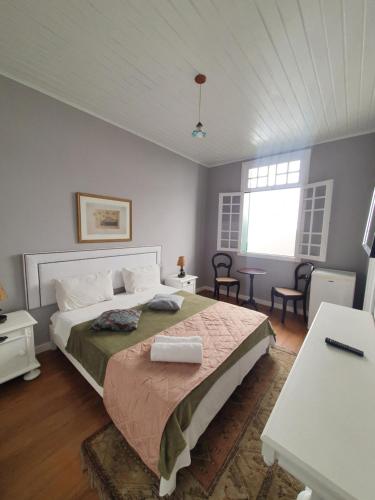 a bedroom with a large bed in a room at Casa Villa Constanza in Itaipava