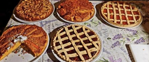 a table topped with four pies sitting on top of a table at B&B Margot in Albavilla