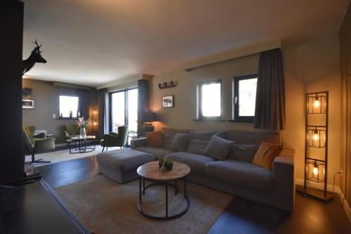 Posezení v ubytování DURBUY-COSY APPARTEMENT