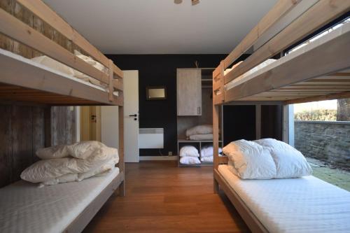 two bunk beds with pillows on them in a room at DURBUY-COSY APPARTEMENT in Durbuy
