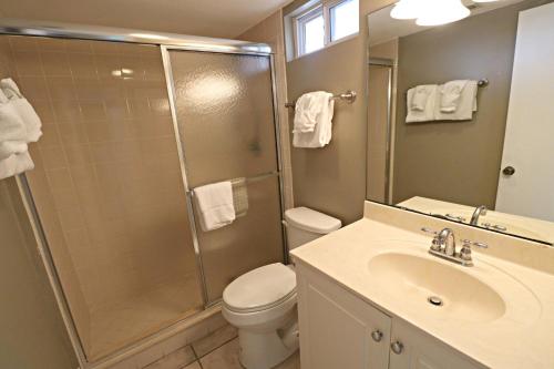 a bathroom with a shower and a toilet and a sink at Inn at Camachee Harbor View 10 in Saint Augustine