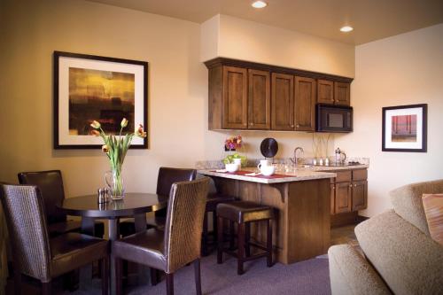 a living room filled with furniture and a table at Red Mountain Resort in St. George