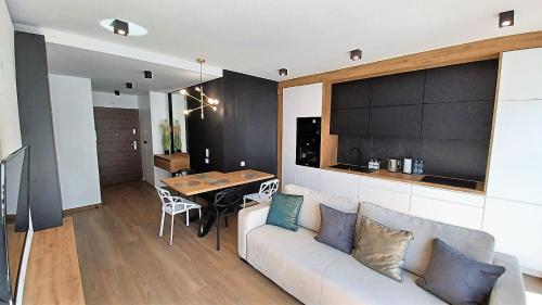 Posedenie v ubytovaní Kima Apartament Bażantów 44