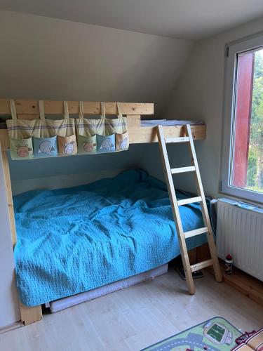 A bed or beds in a room at Balatonakarattya Magaspart