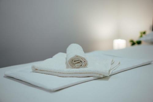 a stack of towels sitting on a counter in a bathroom at Apartman Biokovo in Imotski