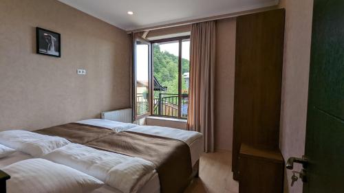 Postel nebo postele na pokoji v ubytování Villa Jiji