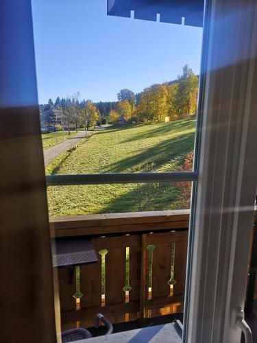 a view of a field from a window at Schwarzwald-Chalet Feldberg in Feldberg