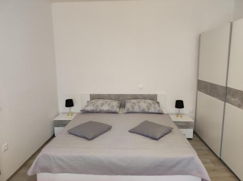 Postel nebo postele na pokoji v ubytování Apartments Erenda
