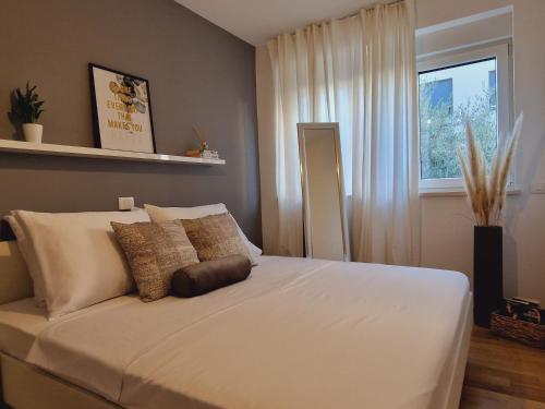 Posteľ alebo postele v izbe v ubytovaní Apartman Adara