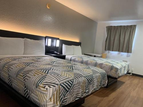 Кровать или кровати в номере Motel 6-Atlanta, TX