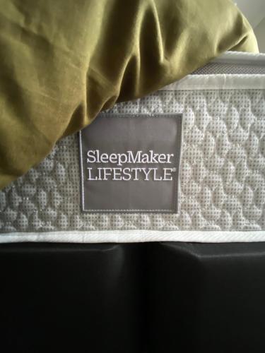 a close up of a bed with a sleep maker lifetime style mattress at The Great Escape, Luxury Waterfront, HotTub in Whitianga