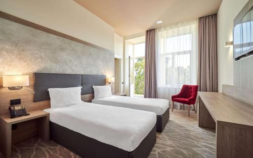 Postel nebo postele na pokoji v ubytování Radisson Hotel City Centre Odesa