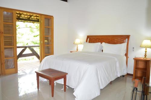 Ein Bett oder Betten in einem Zimmer der Unterkunft Artesanal Gourmet e Pousada