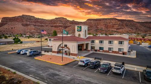 a hotel with cars parked in a parking lot at Quality Inn Kanab National Park Area in Kanab