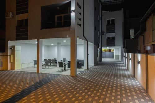 an empty hallway of a building with a dining area at Hany Sweet in Niš