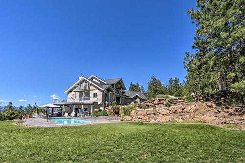 a large house with a swimming pool in the yard at Secluded Home with Pool about 14 Mi to Coeur dAlene! in Post Falls