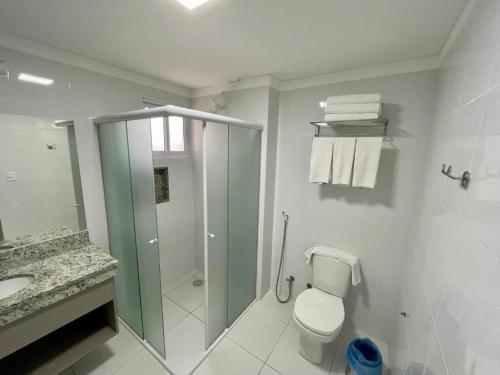 a bathroom with a shower and a toilet and a sink at Piazza diRoma - C/ Acesso Acqua Park in Caldas Novas