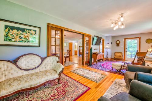 a living room with a couch and a table at Birdsong Rambler in Weaverville
