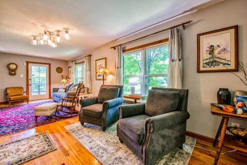 a living room with chairs and a window at Birdsong Rambler in Weaverville
