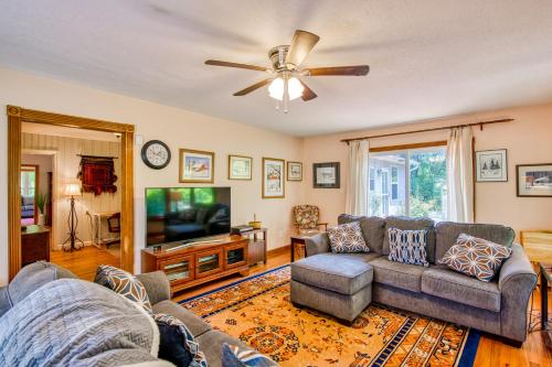 a living room with a couch and a tv at Birdsong Rambler in Weaverville
