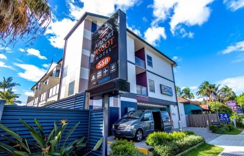 a building with a large sign in front of it at Airport Ascot Motel in Brisbane