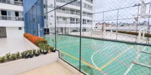 a view of a tennis court in a building at APARTAMENTO LUXUOSO A 1KM DA LITORÂNEA in São Luís