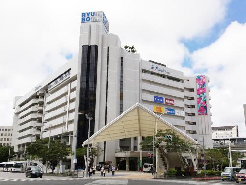a large building with a sign on top of it at Hotel Abest Naha Kokusai Street in Naha
