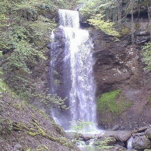 a waterfall on the side of a mountain at Sim Guesthouse in Sım