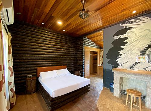 Krevet ili kreveti u jedinici u objektu Eagle Ranch Resort Port Dickson