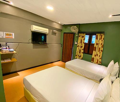 Cama o camas de una habitación en Eagle Ranch Resort Port Dickson