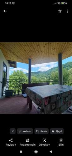 a picture of a table in a room with a view at Sim Guesthouse in Sım