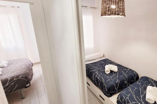 Postel nebo postele na pokoji v ubytování Precioso Apartamento a 3 minutos de la Playa, con parking gratuito