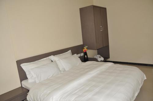 Katil atau katil-katil dalam bilik di HOTEL NEW BHARTI