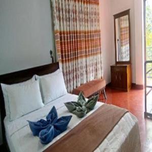 Postel nebo postele na pokoji v ubytování Ramboda holiday Inn