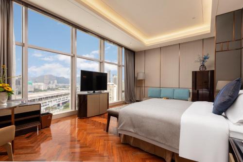Cama o camas de una habitación en Zhuhai Longzhuda International Hotel