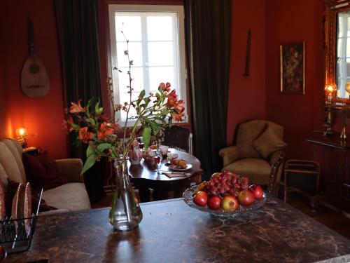 a room with a table with a bowl of fruit on it at Alban Berg Villa in Trahütten
