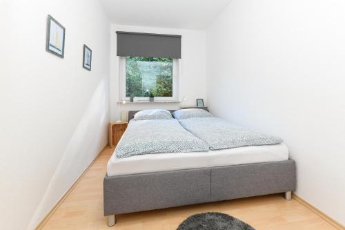 Postel nebo postele na pokoji v ubytování Ferienwohnung Nordseebutze