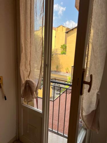 an open door with a view of a balcony at Moonlight Centro Bologna in Bologna