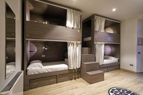 a bedroom with two bunk beds in it at "La Locanda" Campione del Garda in Campione del Garda