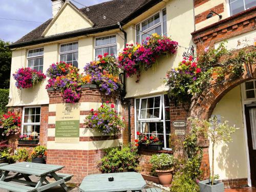 a building with flower boxes on the side of it at Wye Valley Hotel in Tintern