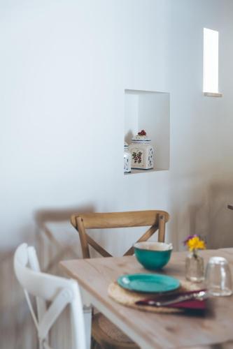 a wooden table with two bowls on top of it at Antica Villa Colonica in Sorso