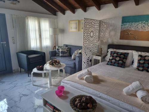 a living room with a bed and a couch at VILLA TELLINA in Skiathos Town