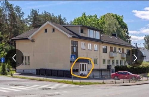 a house with a yellow circle in front of it at Apartment with 2bedrooms near the train and buss station in Moss