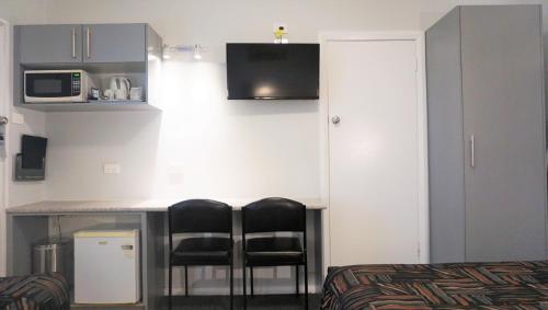 Een TV en/of entertainmentcenter bij Harden Country Motel
