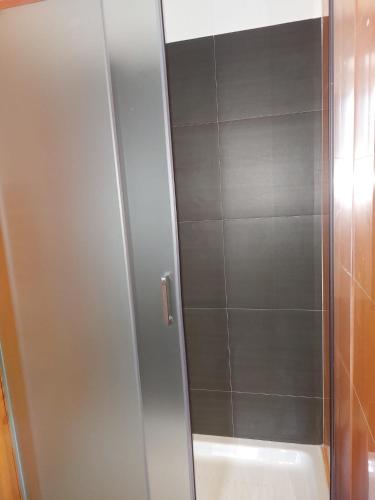 a shower with a glass door in a bathroom at B&B Anastasia in Buccino