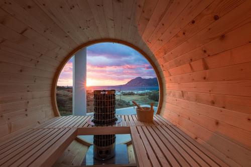 an inside view of a sauna with a round window at Villa Mayeia in Plakias